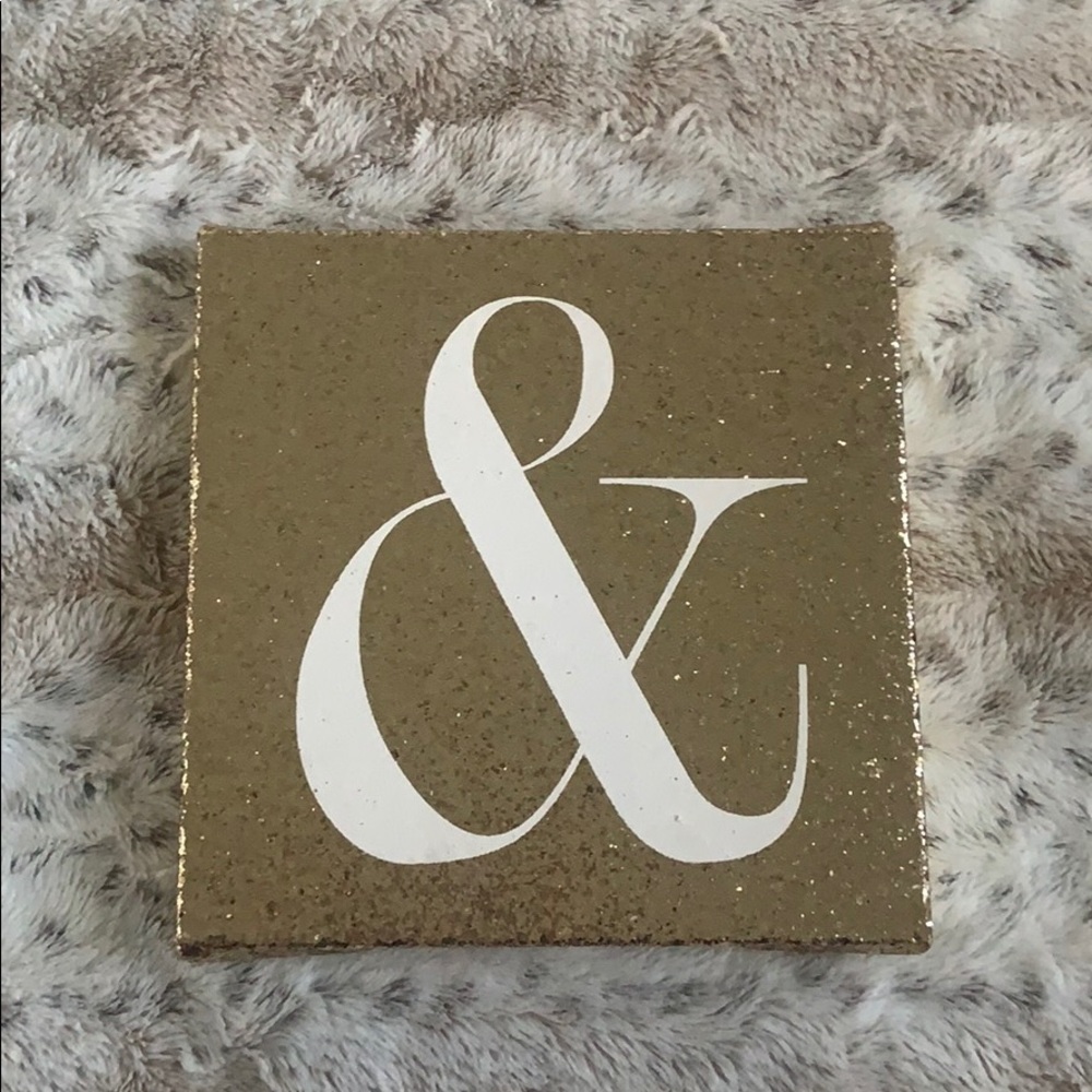 Gold glitter & sign.